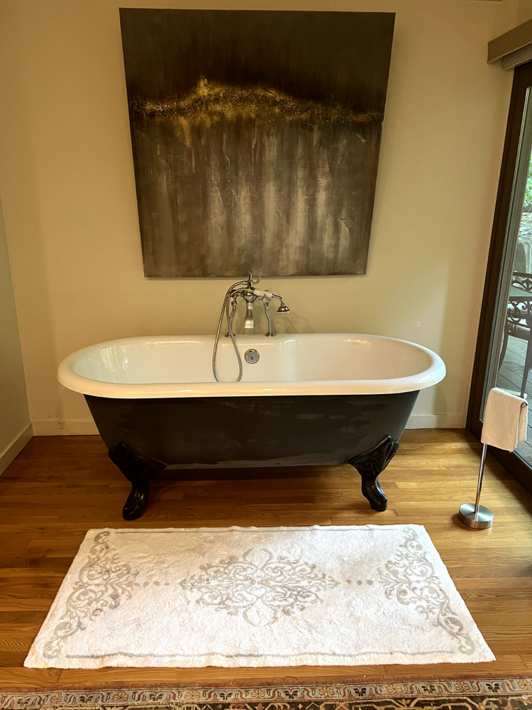 66” Porcher cast iron bathtub with clawfoot legs and polished chrome fixtures