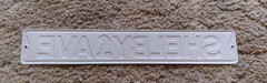 Shelby Ave Metal Sign Snake Logo Black and White Decor Wall Art 20 x 3.33in