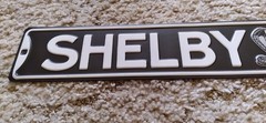Shelby Ave Metal Sign Snake Logo Black and White Decor Wall Art 20 x 3.33in