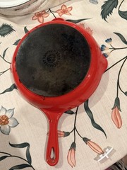 Le Creuset red Sauté Pan With Black Non Stick Coating Inside, Enamel Outside.