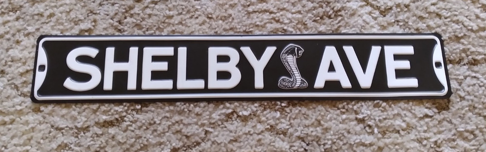 Shelby Ave Metal Sign Snake Logo Black and White Decor Wall Art 20 x 3.33in